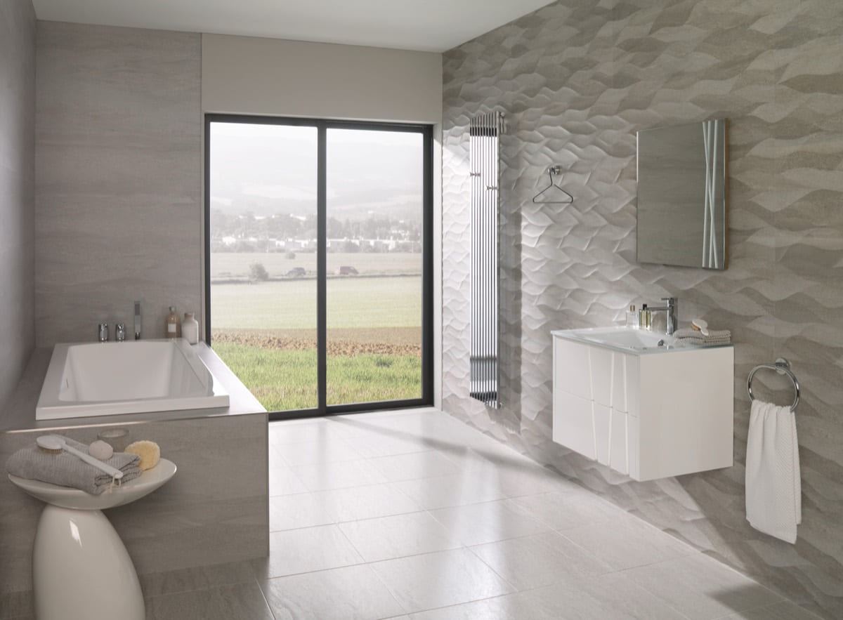 Porcelanosa Madagascar Natural ceramic tiles fitted in a room, grey, matt