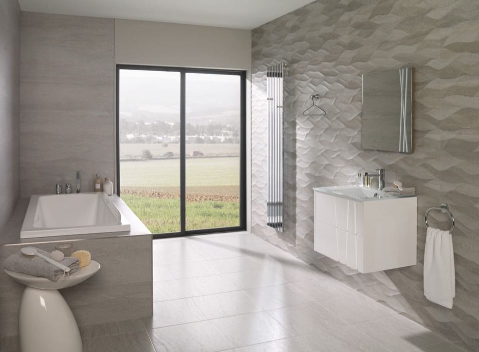 Porcelanosa Madagascar Natural ceramic tiles fitted in a room, grey, matt