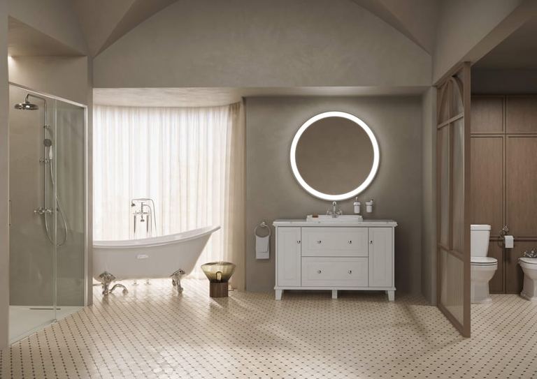 Carmen basin unit and lit round mirror beside a roll-top bath
