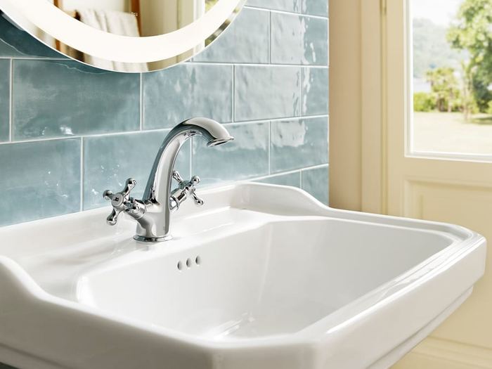 Carmen basin with cross-head taps against blue metro tiles
