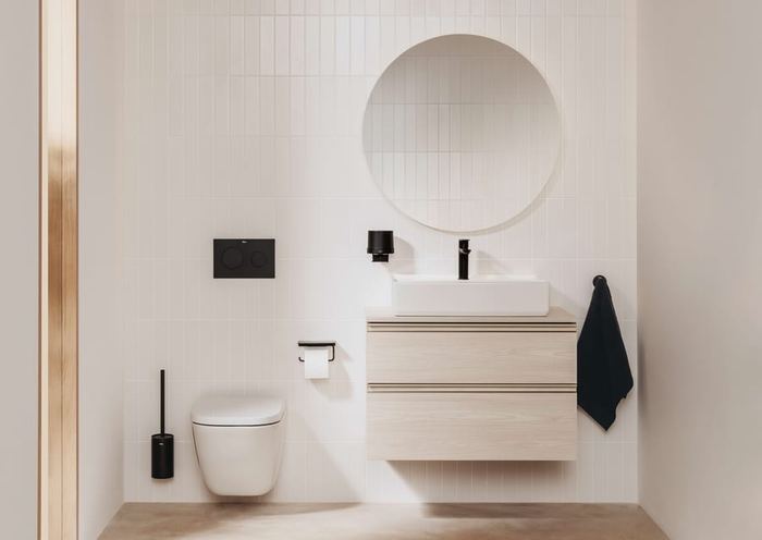 The Gap wall-hung unit with a round mirror, wall-hung WC and black brassware