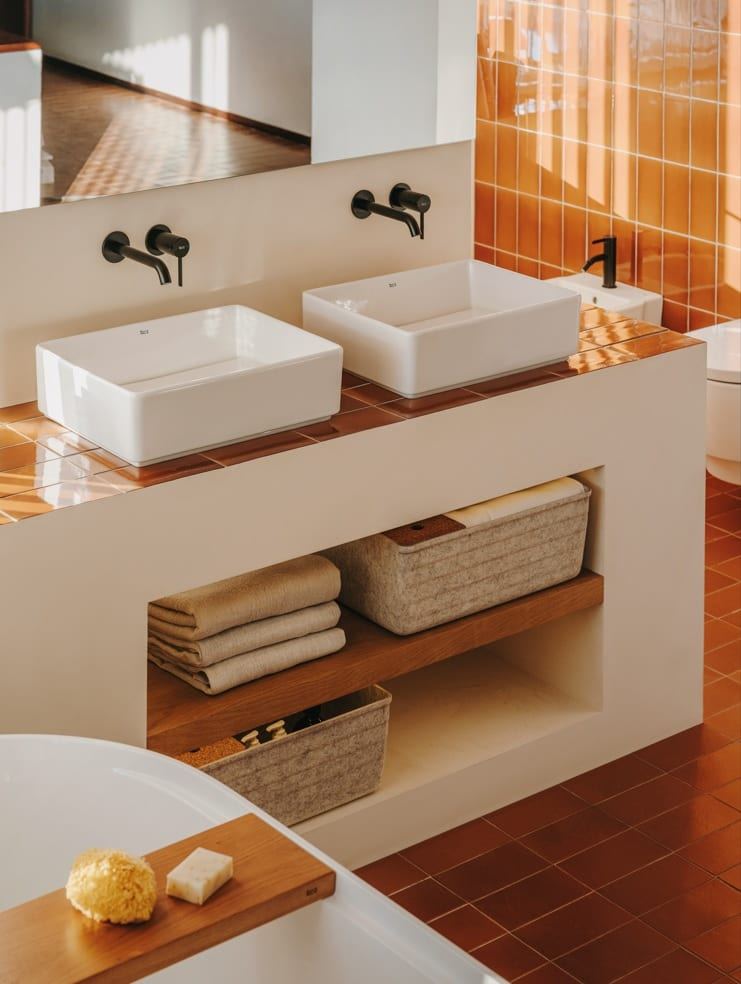 Tura twin countertop basins on a wooden shelf