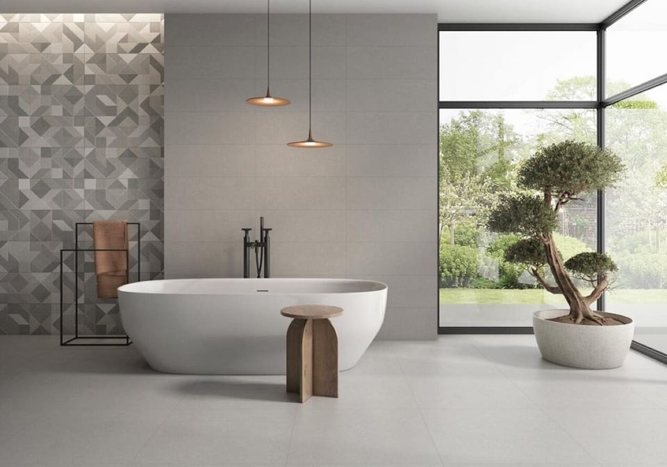 Rodano Perla porcelain tiles fitted in a room, grey, satin