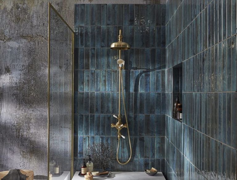 Keswick exposed shower system in brushed brass on blue tiles