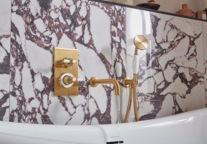 Keswick concealed shower valve and handset against marble