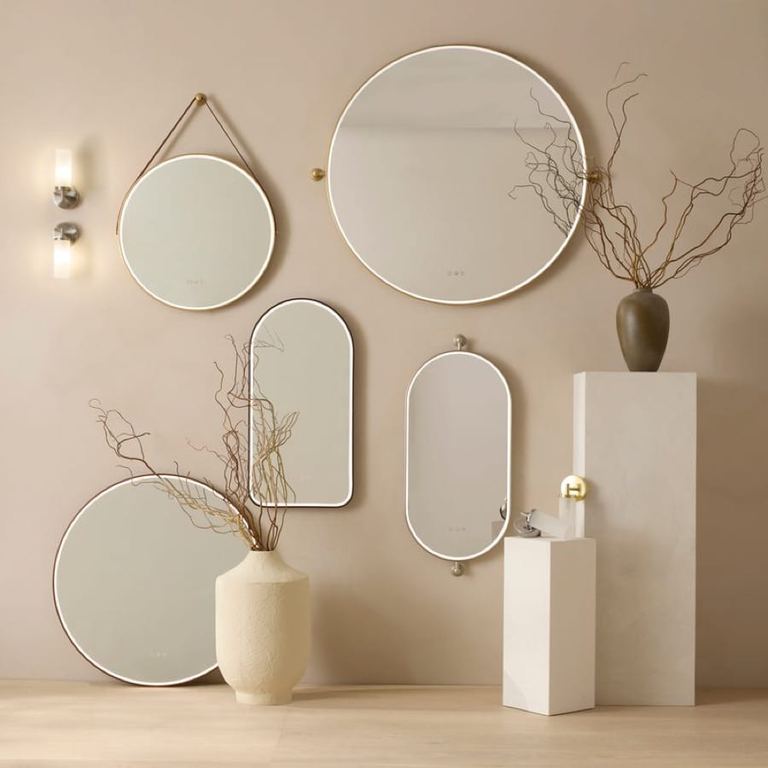 Walcot circular and pill mirrors on a plastered wall