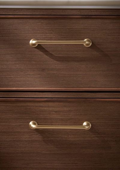 Walcot brass pull handles on a Walnut drawer front