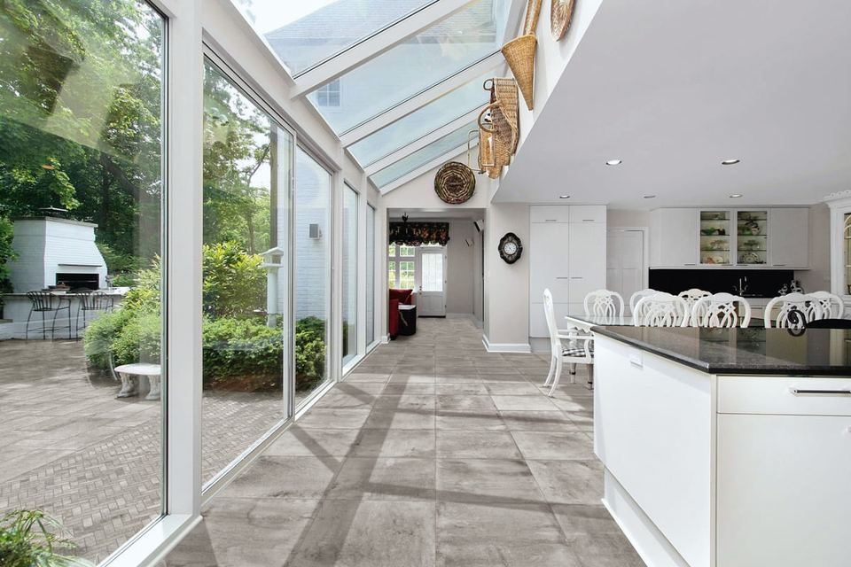 Stoneway Ardesia Grigio porcelain tiles fitted in a room, grey, matt