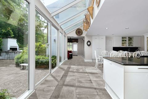Stoneway Ardesia Grigio porcelain tiles fitted in a room, grey, matt