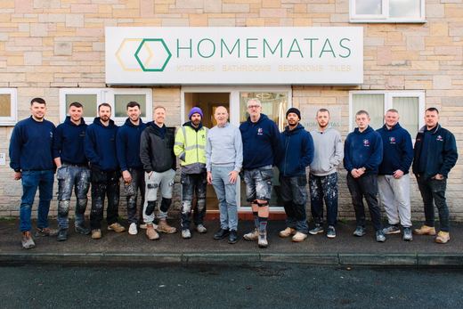 The Homematas team outside the Bamber Bridge showroom, under the shop sign