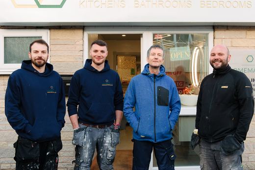 Four members of the Homematas team outside the showroom entrance