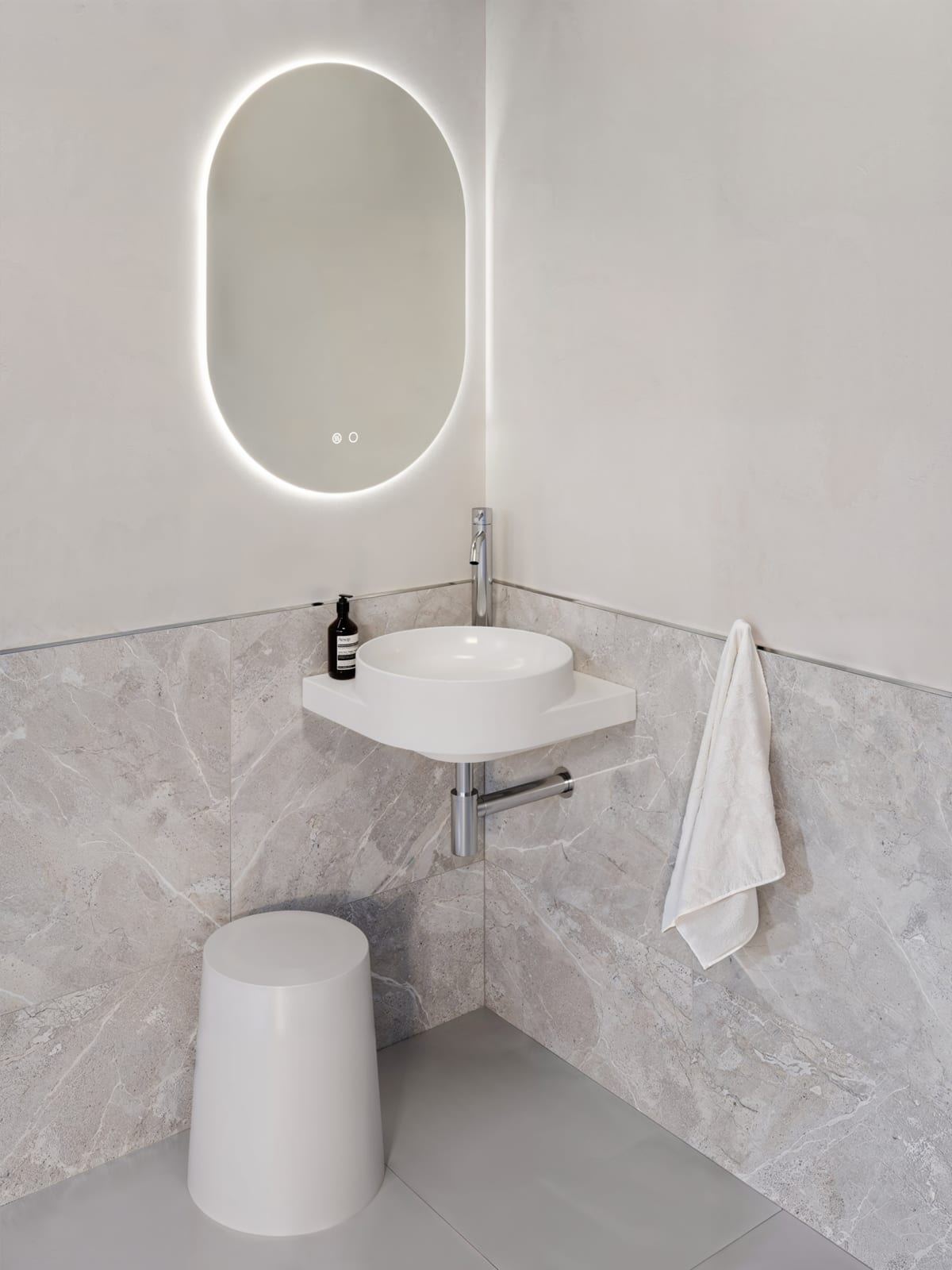 Davoli sanitaryware in a marble-lined bathroom