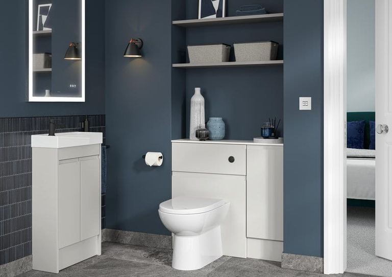 Elmore WC unit in Glossy White against a navy wall