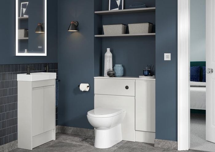 Elmore WC unit in Glossy White against a navy wall
