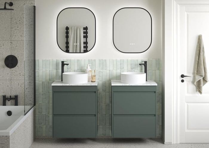 Elmore twin vanities in Muted Green beside a bath